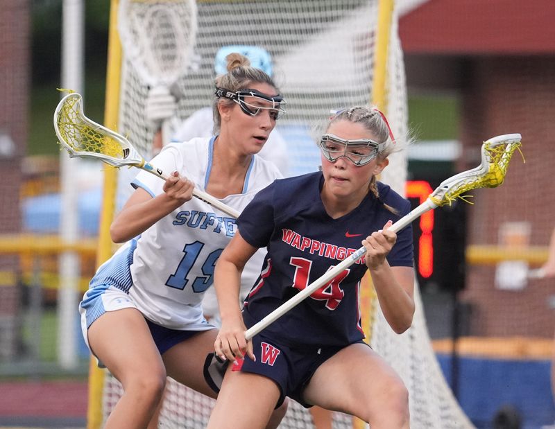 Wappingers' Ava Feliciotto (14) and Suffern's Nocole DeBellis (19) in action during the in the Section 1 Class A girls lacrosse championship game at Lakeland High School in Shrub Oak on Tuesday, Jun 3, 2025.