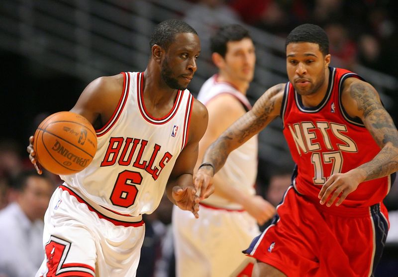 Mar 27, 2010; Chicago, IL, USA; Chicago Bulls guard Ronald Murray (6) is defended by New Jersey Nets forward Chris Douglas-Roberts (17) during the second half at the United Center. The Bulls defeated the Nets 106-83. Mandatory Credit: Dennis Wierzbicki-USA TODAY Sports