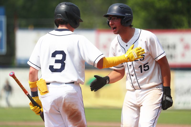 Burke Catholic's, from left Jordan Drucker gets some motivation from John Cook before going up to bat during the New York State Class B baseball playoff game versus Section XI's Bridgehampton/Ross on June 5, 2025.