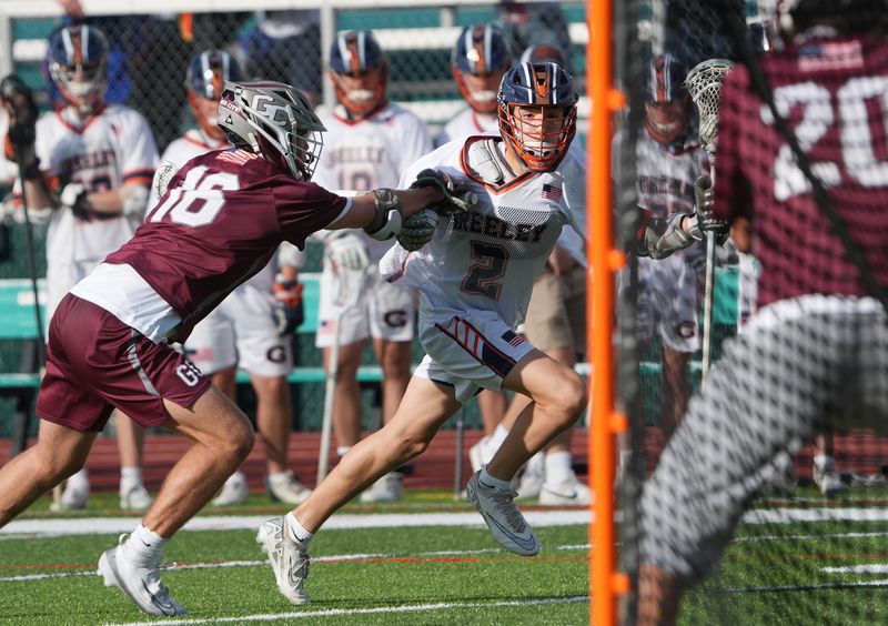 Greeley’s Jake Gashi (2) drives to the goal against Garden City during the boys lacrosse state regional semifinal at Yorktown High School June 7, 2025.