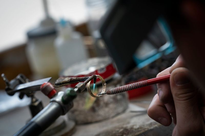 Ben Warner, 36, of Warren, a bench jeweler at Miner’s Den Jewelers in Royal Oak, sizes a ring on Thursday, May 22, 2025.
