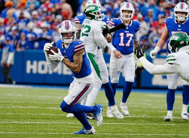 Buffalo Bills wide receiver Keon Coleman (0) runs with the ball after catching a pass during first half action at the Bills home game against the New York Jets at Highmark Stadium in Orchard Park on Dec. 29, 2024.
