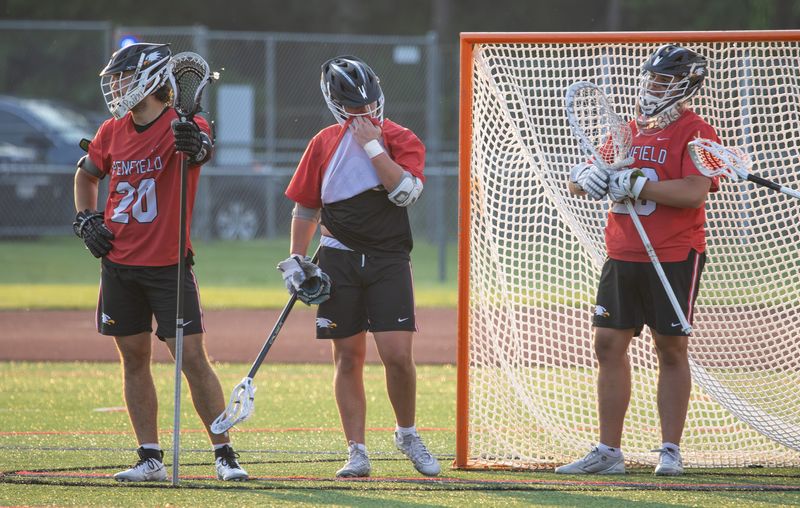 Penfield players, from left, AJ Theodorakakos, Alex McVean and Mason Schembri react after allowing a goal to West Genesee-III during the NYSPHSAA Class A semifinals Wednesday, June 11 at SUNY Cortland.