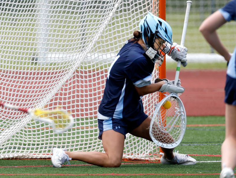 Suffern goalie Jillian Terlizzi makes a save against Ithaca during the Mounties' 11-5 state Class A semifinal win June 13, 2025 at SUNY Cortland.