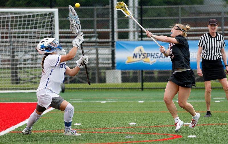 Penfield’s Jenna Capozzi scores on this point blank shot on Cicero- North Syracuse goalie Jillian Howell.