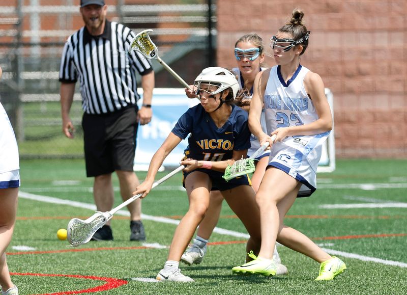 Victor’s Camryn Adrid scores on this backhanded shot against Columbia .