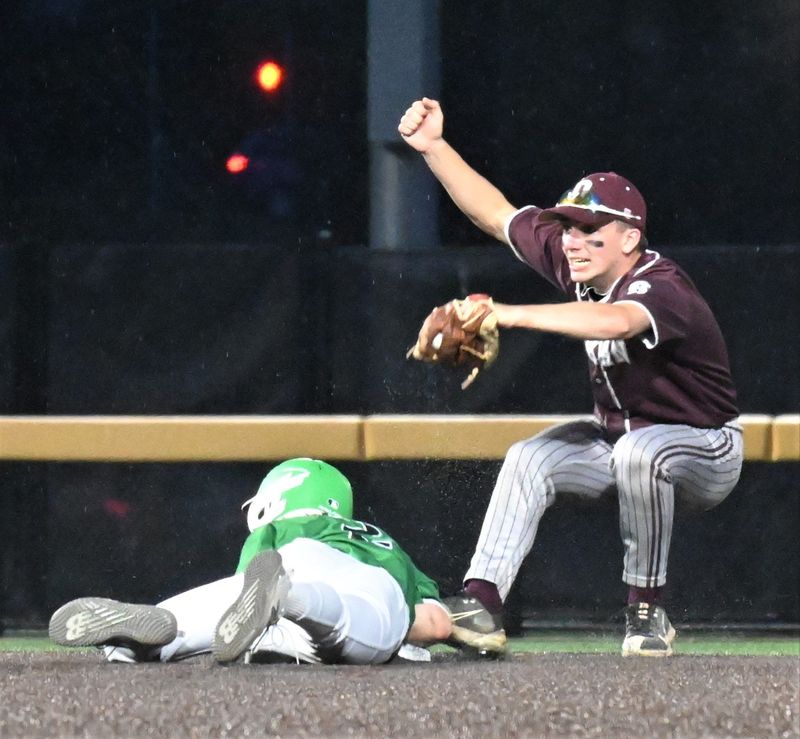 Oriskany shortstop Sean Graziano pumps hs fist and falls backward after tagging out a Fillmore base-staler in Friday's state Class D semifinal playoff game at SUNY-Binghamton.