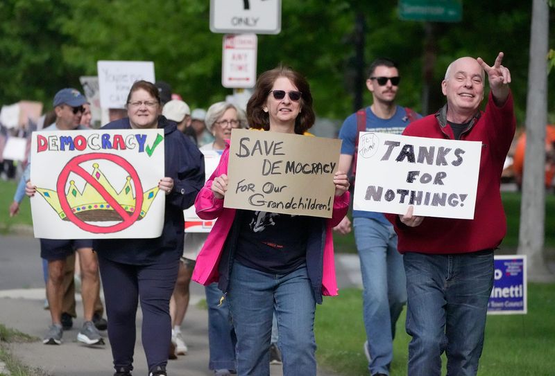 Area residents were taking part in a national protest called, "No King's Day" which is to protest the military parade and President Donald Trump's various executive orders. This crowd, who had met up near Brighton Memorial Library, marched down to 12 Corners in Brighton on June 14, 2025.