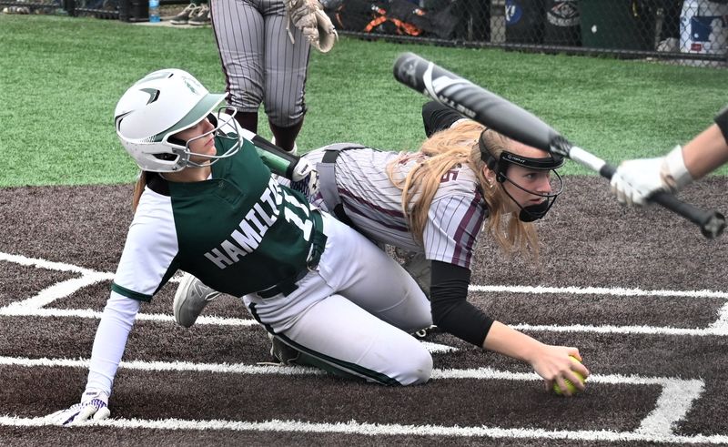 Rihana Dye scores the winning run for Hamilton as Argyle Scot Ava Cormie (right) grabs the ball during the seventh inning of New York's Class D championship game Saturday at Greenlight Networks Grand Slam Park in Binghamton.