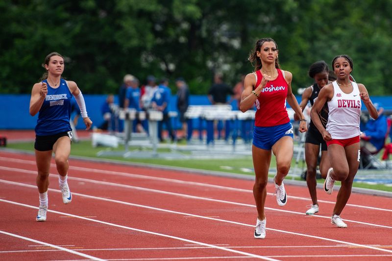 Joy Sawyer of Goshen (red) wins the girls 200 meter dash during the NYSPHSAA track and field championship meet at Middletown High School in Middletown, NY on Saturday, June 14, 2025.. Kelly Marsh/Special to the Journal News