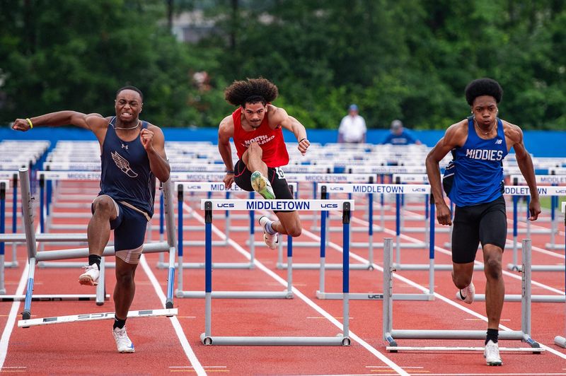 North Rockland's Darwin Amonte and Middletown's Quillar Baidy, right, compete in the boys 110 meter hurdles during the NYSPHSAA track and field championship meet at Middletown High School on Saturday, June 14, 2025.. Kelly Marsh/Special to the Journal News