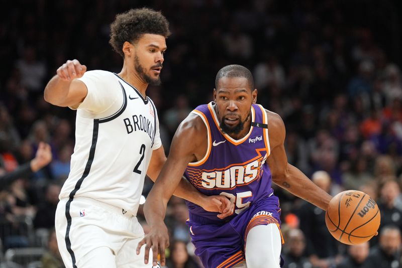 Nov 27, 2024; Phoenix, Arizona, USA; Phoenix Suns forward Kevin Durant (35) drives against Brooklyn Nets forward Cameron Johnson (2) during the first half at Footprint Center. Mandatory Credit: Joe Camporeale-Imagn Images