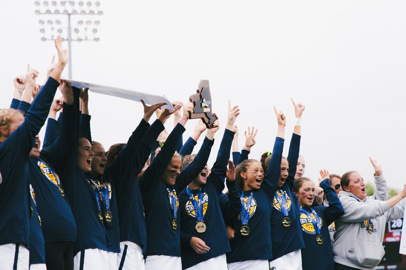 Victor celebrates with the NYSPHSAA championship plaque after defeating Garden City in the Class B final Saturday, June 14 at SUNY Cortland.