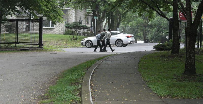 Children walk across the entrance to Kennedy Park at Old Nyack Turnpike in Spring Valley June 17, 2025. A four-year-old girl was killed at this spot by a car that ran off the road.
