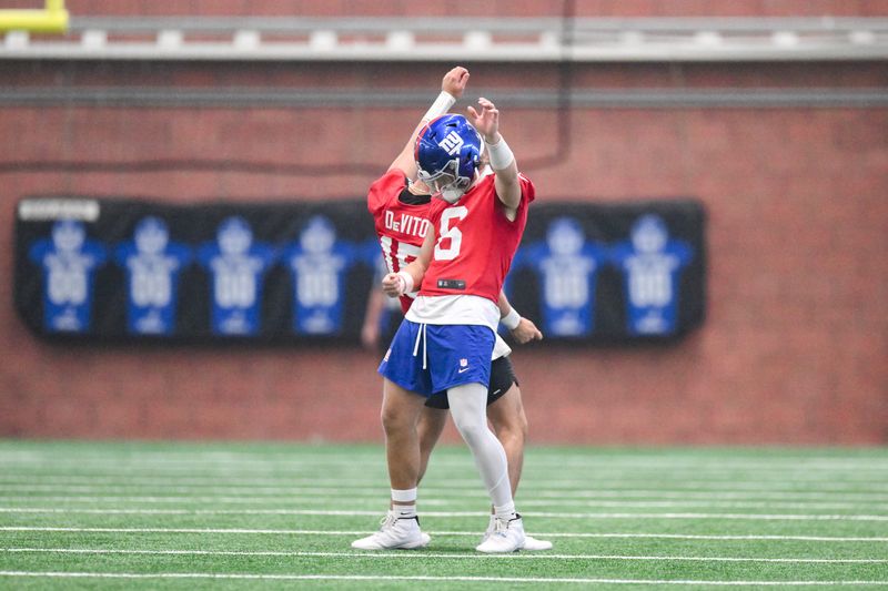 Jun 17, 2025; East Rutherford, NJ, USA; New York Giants quarterback Tommy DeVito (15) and quarterback Jaxson Dart (6) interact during minicamp at Quest Diagnostics Training Center. Mandatory Credit: John Jones-Imagn Images