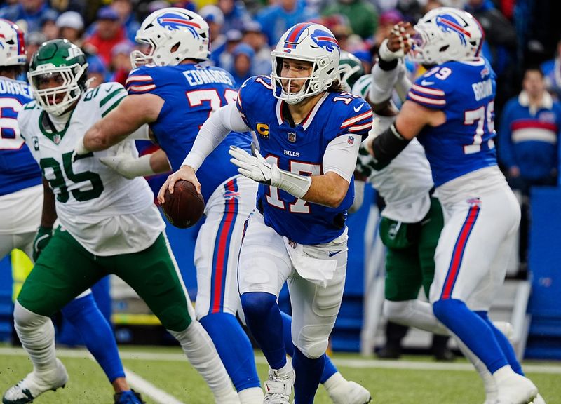 Buffalo Bills quarterback Josh Allen (17) runs with the ball for a gain of about eight-yards during first half action at the Bills home game against the New York Jets at Highmark Stadium in Orchard Park on Dec. 29, 2024.