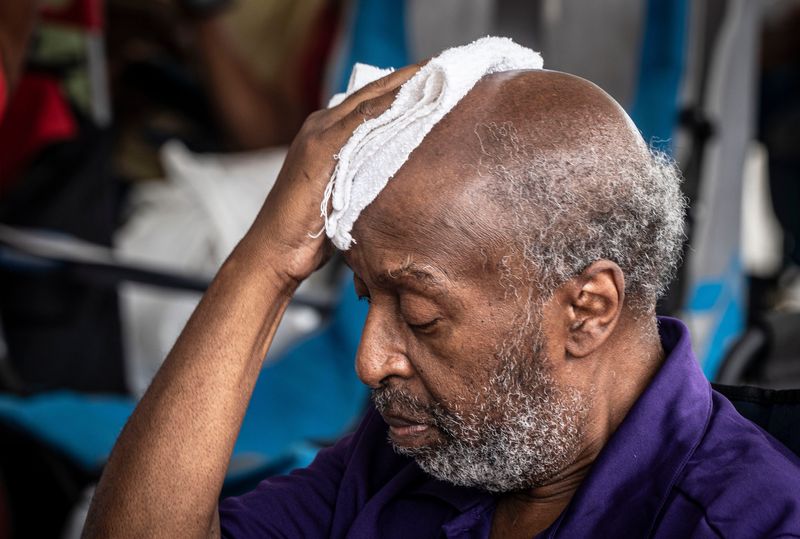 Allen Kelly of Port Chester, N.Y. towels the sweat from his head as he attends the African-American Cultural Celebration at Kensico Dam Plaza in Valhalla, N.Y. June 22, 2025. Temperatures approached 90 degrees in the Lower Hudson Valley on Sunday and will remain in 90's through Wednesday.