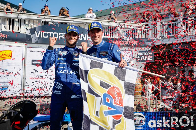 Colin Braun and Tom Blomqvist celebrate their overall win in the Sahlen's Six Hours of The Glen on June 22, 2025 at Watkins Glen International.