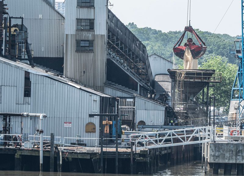 Raw sugar is offloaded from a ship at the Domino Sugar refinery in Yonkers June 23, 2025. The parent company, ASR Group, has announced that the refinery will close by the end of 2025.