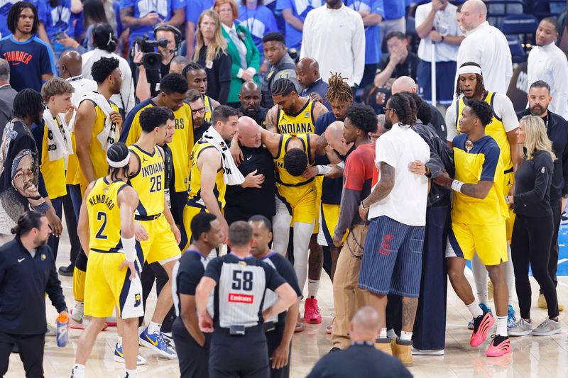 Jun 22, 2025; Oklahoma City, Oklahoma, USA; Indiana Pacers guard Tyrese Haliburton (0) is assisted after an apparent injury following a play against the Oklahoma City Thunder during the first half of game seven of the 2025 NBA Finals at Paycom Center. Mandatory Credit: Alonzo Adams-Imagn Images
