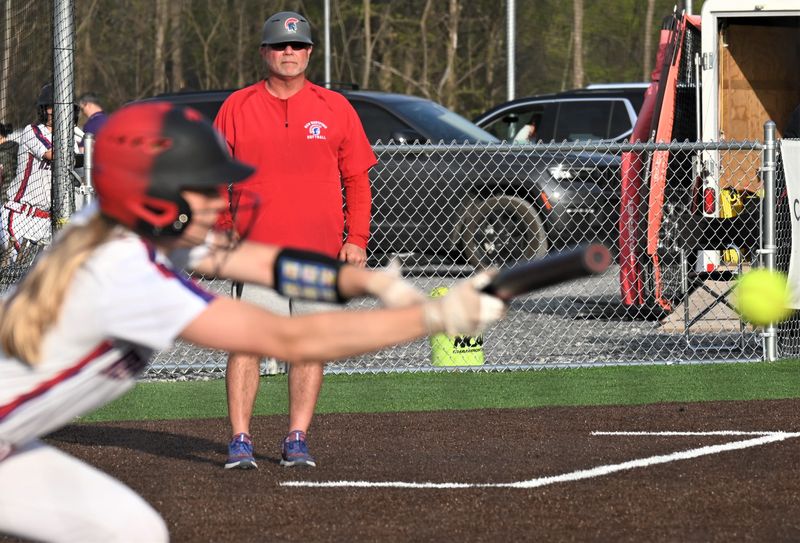 New Hartford softball coach Dan Stalteri watches a Spartan bunt during a May 1 game against Rome Free Academy at the Accelerate Sports Complex. Stalteri is leaving New Hartford to take the head coaching position at Herkimer College.
