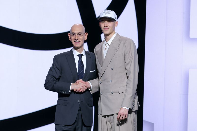 Jun 25, 2025; Brooklyn, NY, USA; Egor Demin stands with NBA commissioner Adam Silver after being selected as the eighth pick by the Brooklyn Nets in the first round of the 2025 NBA Draft at Barclays Center. Mandatory Credit: Brad Penner-Imagn Images