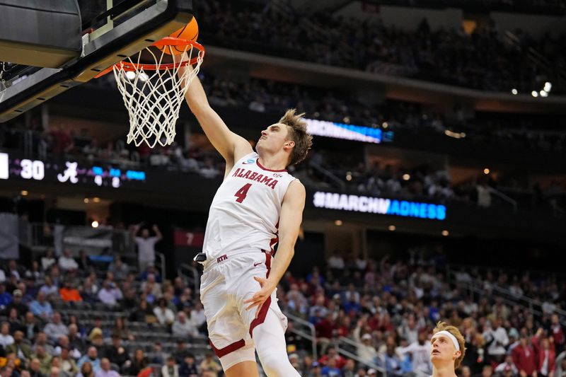 Mar 27, 2025; Newark, NJ, USA; Alabama Crimson Tide forward Grant Nelson (4) dunks the during the first half against the Brigham Young Cougars during an East Regional semifinal of the 2025 NCAA tournament at Prudential Center. Mandatory Credit: Robert Deutsch-Imagn Images
