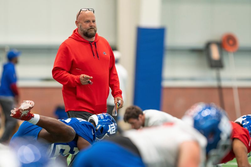 New York Giants head coach Brian Daboll watches his players warm up during Mandatory Minicamp at Quest Diagnostics Giants Training Center in East Rutherford on Tuesday, June 17, 2025.