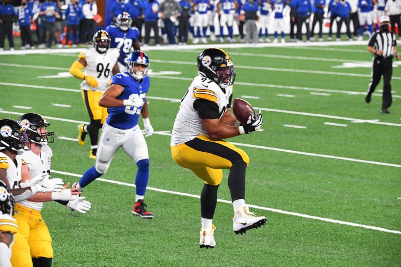Sep 14, 2020; East Rutherford, New Jersey, USA; Pittsburgh Steelers defensive tackle Cameron Heyward (97) intercepts a tipped pass against the New York Giants at MetLife Stadium. Mandatory Credit: Robert Deutsch-USA TODAY Sports