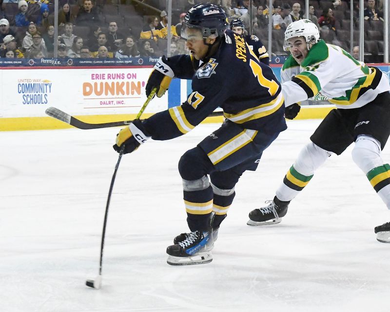 Erie Otters forward Malcolm Spence, left, shoots against the London Knights during an Ontario Hockey League playoff game at Erie Insurance Arena in Erie on April 15, 2025.