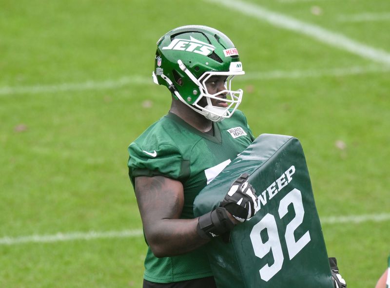 Jun 10, 2025; East Rutherford, NJ, USA; New York Jets offensive tackle Armand Membou (70) participates in a drill during minicamp at Atlantic Health Jets Training Center. Mandatory Credit: John Jones-Imagn Images
