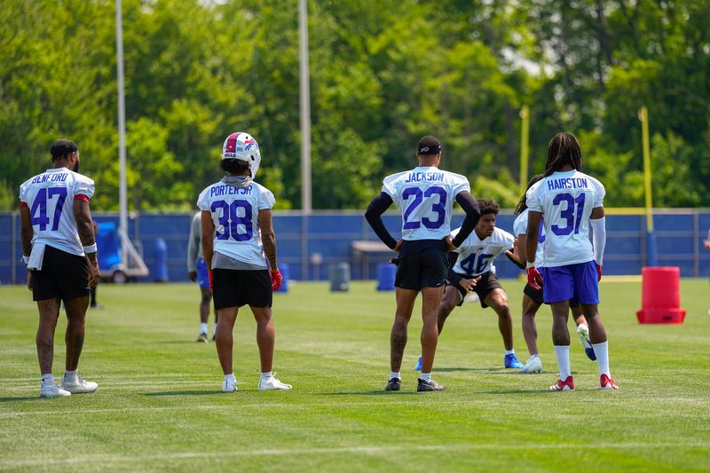Jun 11, 2025; Orchard Park, NY, USA; Buffalo Bills cornerback Christian Benford (47) and defensive back Daryl Porter (38) and cornerback Dane Jackson (23) and cornerback Maxwell Hairston (31) watch cornerback Ja'Marcus Ingram (46) work out during Minicamp at Highmark Stadium. Mandatory Credit: Gregory Fisher-Imagn Images