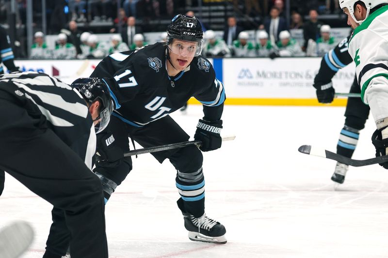 Dec 2, 2024; Salt Lake City, Utah, USA; Utah Hockey Club center Nick Bjugstad (17) sticks his tongue out while waiting for a face-off during the third period against the Dallas Stars at Delta Center.