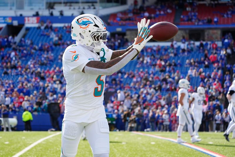 Nov 3, 2024; Orchard Park, New York, USA; Miami Dolphins cornerback Jalen Ramsey (5) warms up prior to the game against the Buffalo Bills at Highmark Stadium. Mandatory Credit: Gregory Fisher-Imagn Images