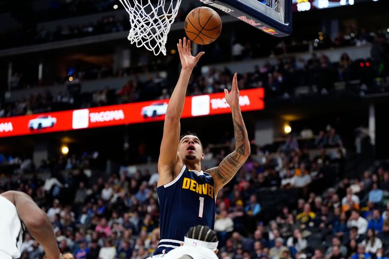 Jan 10, 2025; Denver, Colorado, USA; Denver Nuggets forward Michael Porter Jr. (1) shoots the ball in first quarter against the Brooklyn Nets at Ball Arena. Mandatory Credit: Ron Chenoy-Imagn Images