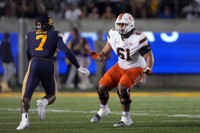 Oct 5, 2024; Berkeley, California, USA; Miami Hurricanes offensive lineman Francis Mauigoa (61) blocks against California Golden Bears linebacker David Reese (7) during the first quarter at California Memorial Stadium. Mandatory Credit: Darren Yamashita-Imagn Images