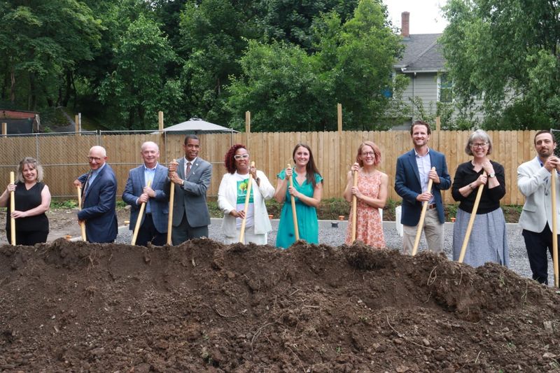 Construction began Tuesday on the Beechwood Family Apartments, a 54-unit affordable housing project scattered across the neighborhood. More than a dozen people attended the groundbreaking ceremony.