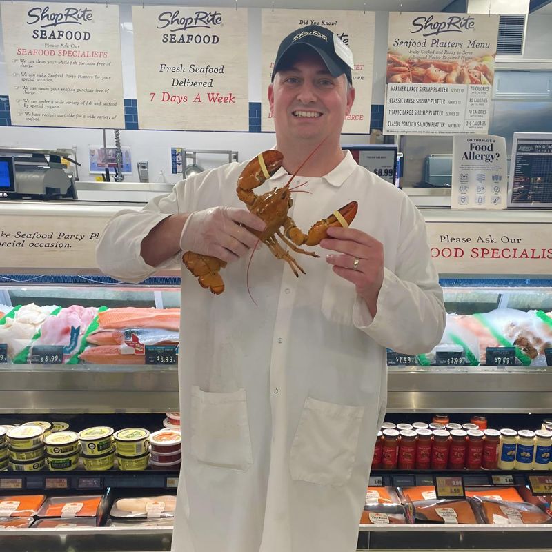 "Jerry," the golden lobster with Anthony Galella, seafood manager of the ShopRite of Carmel in Carmel.