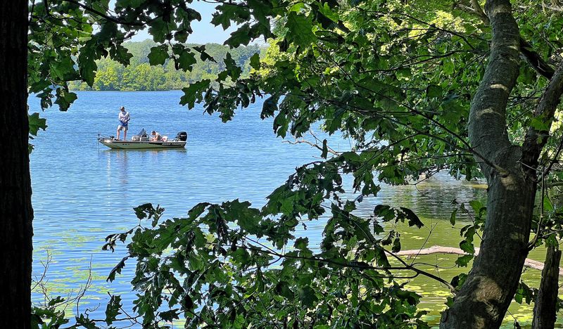 A pair of anglers try their luck near the shoreline while fishing in the Clearfork Reservoir.