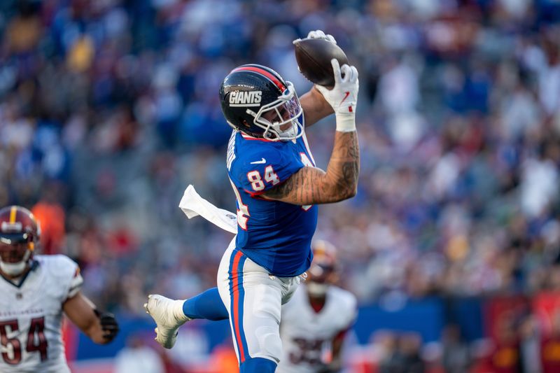 New York Giants tight end Theo Johnson (84) catches a touchdown pass in the fourth quarter during a game between the New York Giants and the Washington Commanders at MetLife Stadium in East Rutherford on Sunday, Nov. 3, 2024.