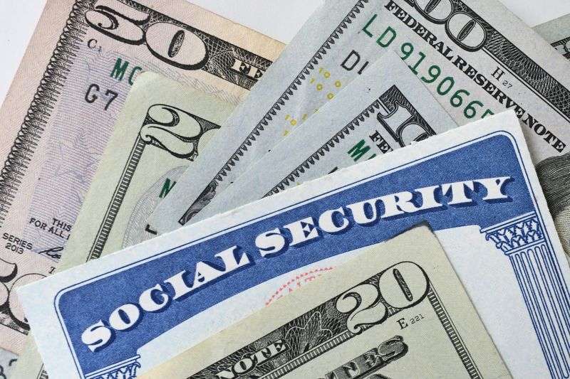 Social Security Card with dollar bills.