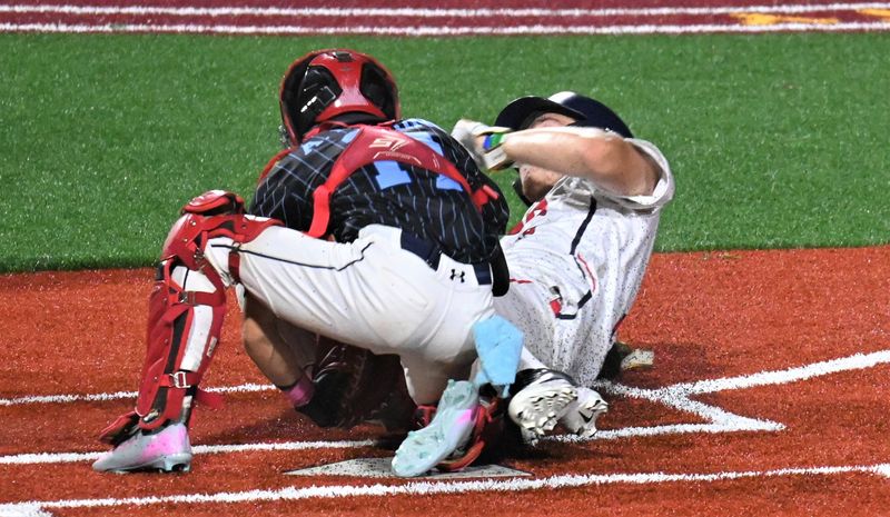 Junior Blue Sox catcher Anthony Marino (left) tags out Utica Post's Reece Jantzi at home plate to complete a game-ending double play and preserve an 8-7 victory in a 10-inning senior division American Legion baseball game Monday.