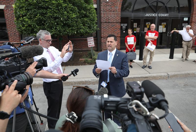 Anthony Costanza, candidate for Irondequoit Town Supervisor, reads a statement to the media outside Irondequoit Town Court after his arraignment there Tuesday, July 8, 2025.