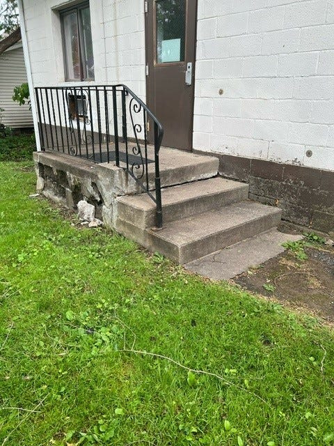 Shown are crumbling stairs at an adult care facility in New York that state auditors found as part of an investigation of state health officials failure to properly inspect the facilities.