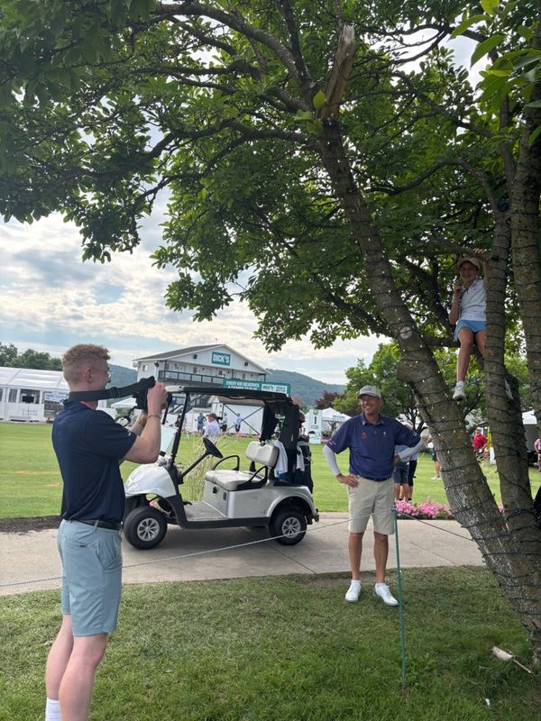 Caroline Caron, 12 (in tree), interviews her father, PGA Tour Champions golfer Jason Caron, during the second round of the Dick's Open on Saturday, July 12, 2025, in Endicott, New York.
