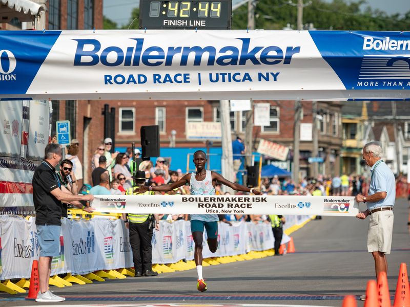 John Korir crosses the Boilermaker finish line in Utica and repeats as 15K champion in 2025 with a time of 42.44. Korir won the Boston Marathon this spring.
