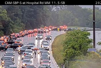 Screenshot from a New York State Department of Transportation camera show southbound traffic on the Sprain Brook Parkway at NY 100 (Hospital Rd.) building as motorists contend with heavy rains and flash flooding in the area.