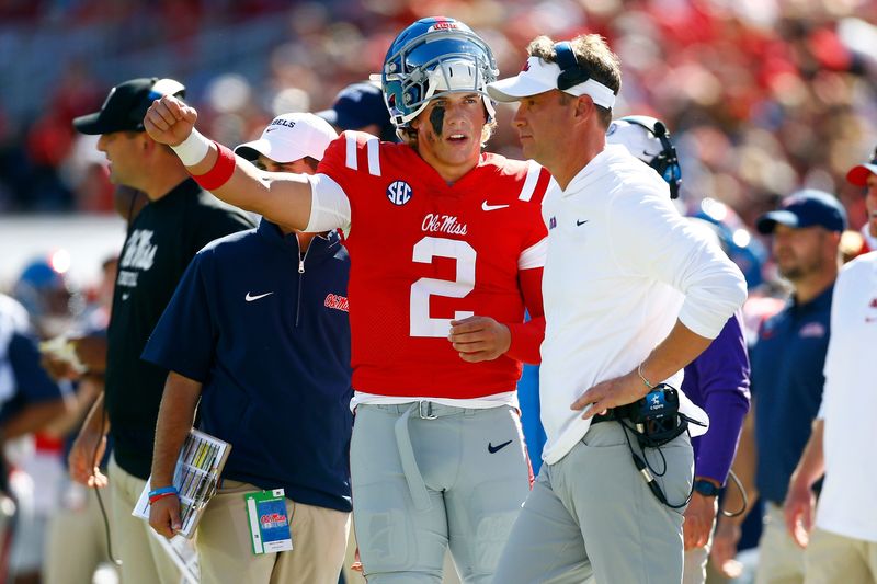 Sep 7, 2024; Oxford, Mississippi, USA; Mississippi Rebels quarterback Jaxson Dart (2) talks with head coach Lane Kiffin on the sideline during the first half against the Middle Tennessee Blue Raiders at Vaught-Hemingway Stadium. Mandatory Credit: Petre Thomas-Imagn Images