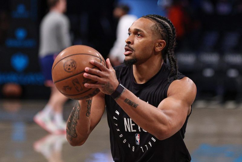 Apr 13, 2025; Brooklyn, New York, USA; Brooklyn Nets guard Tyson Etienne (10) warms up before the game against the New York Knicks at Barclays Center. Mandatory Credit: Vincent Carchietta-Imagn Images