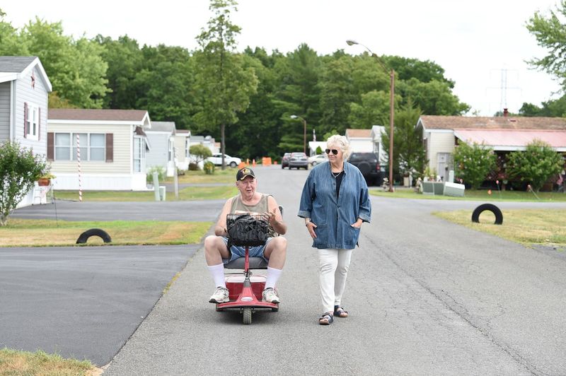 Assemblymember Didi Barrett at Dutch Village Mobile Home Park with resident and advocate Randy Staats.